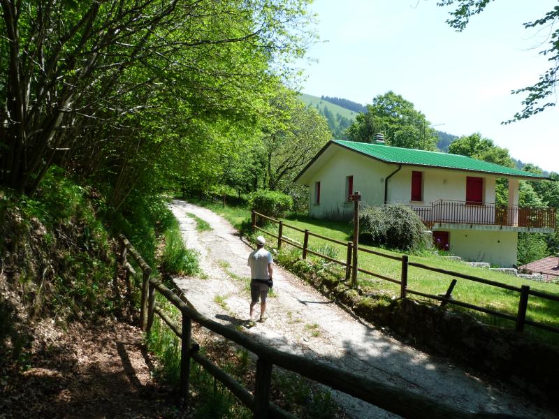 To the left, following the gravel road